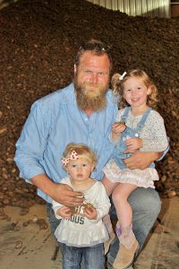 James Baker, pictured with daughters Katy and Sally, hopes to build his farm to a point that would allow him to help his kids pursue farming someday if they want to.