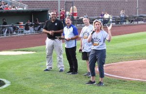Tater Team member and truck driver Melissa thanks the sell-out crowd for coming out. IPC's Travis Blacker is to her right.