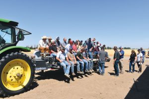 Participants at the Miller Research Potato Pest Management Field Day board a trailer that will take them out into the field. Every year, Miller holds two open houses, one in the summer and one in the winter.