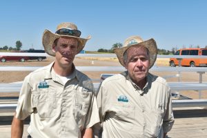 Trent Taysom (left) and Terry Miller with Miller Research answer questions at the company’s field day.