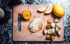 Cooked fish and potatoes on a cutting board