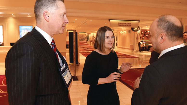 Britt Raybould speaks with Kam Quarles, NPC CEO, (left) and Mike Wenkle, NPC COO, prior to the NPC annual banquet.