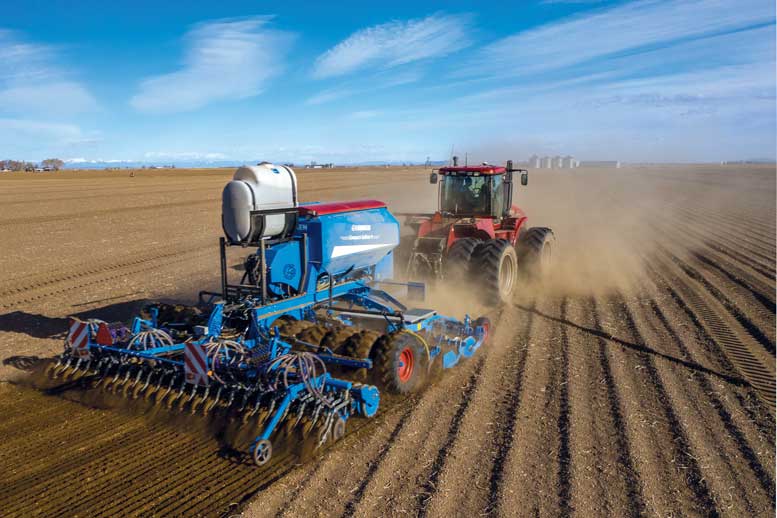 Clay Mitchell plants quinoa. The crop has been part of the farm’s rotation for five years. Photo courtesy SkyDeadPixel